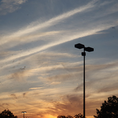 parking lot silhouette against cloudy sunset